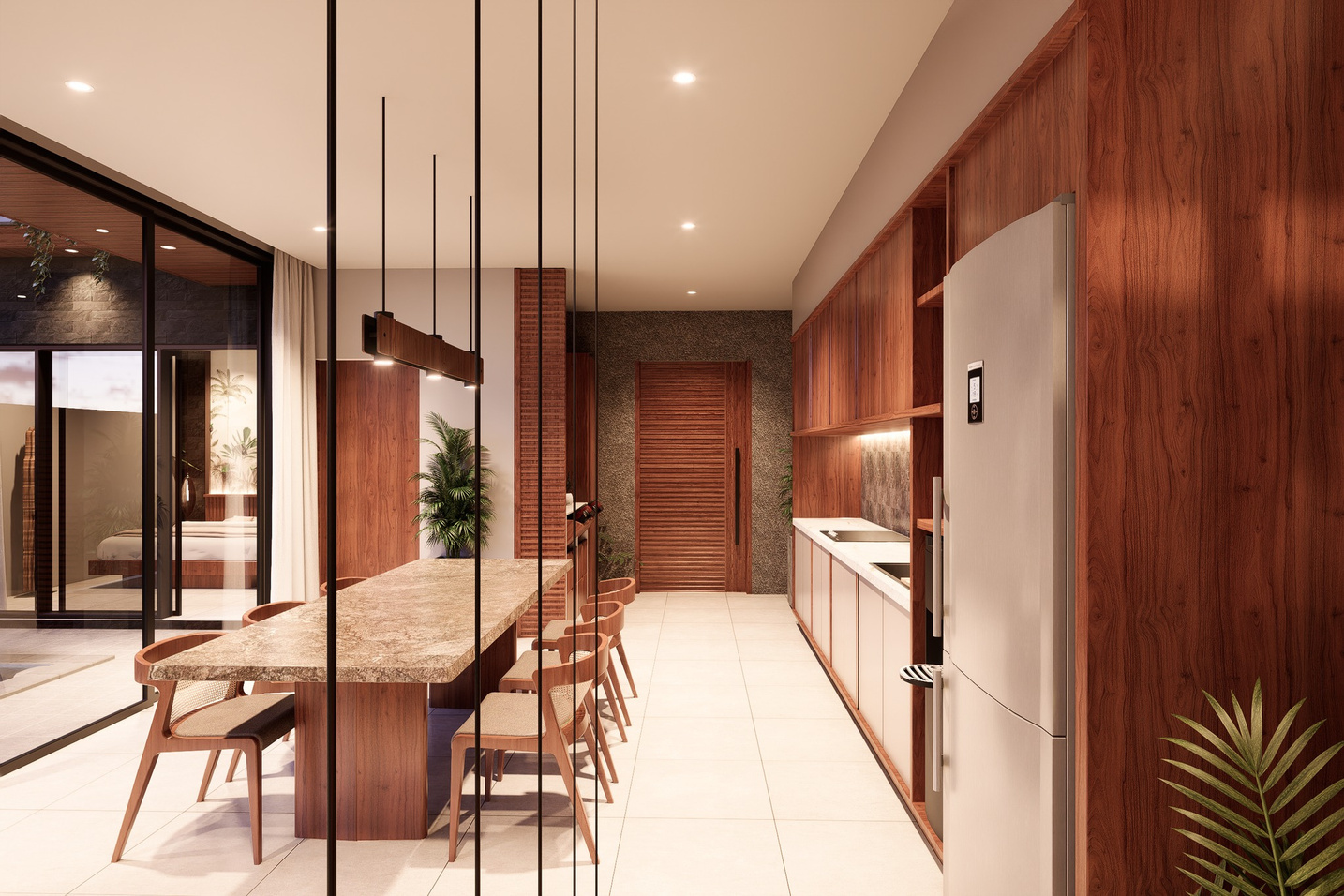 Dining table beneath pendant lighting, opening onto the kitchen and bedroom beyond