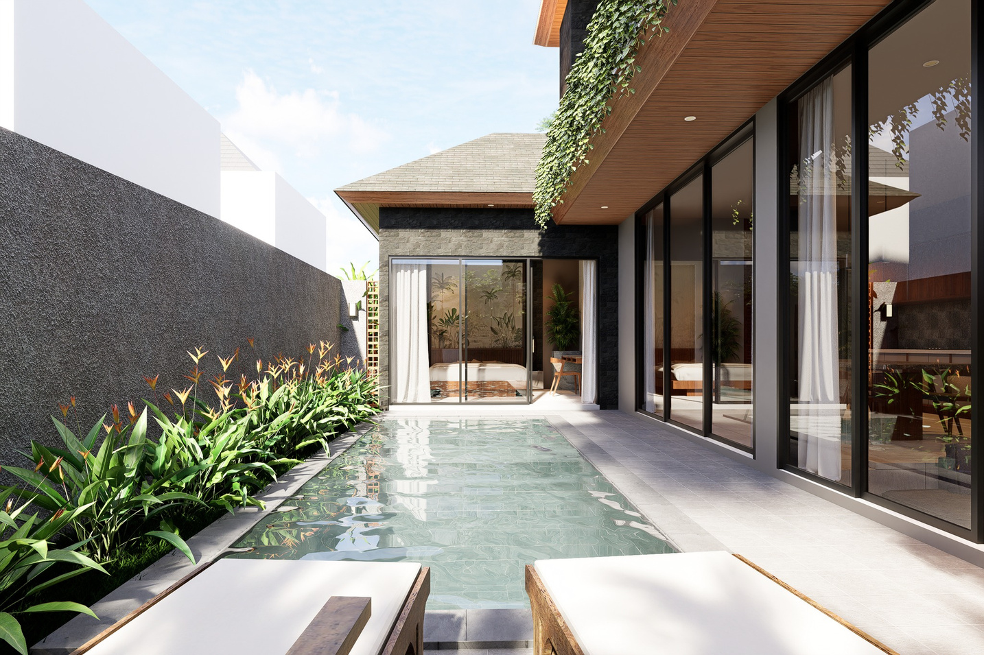 Long view of the villa's edge pool along a stone corridor by day